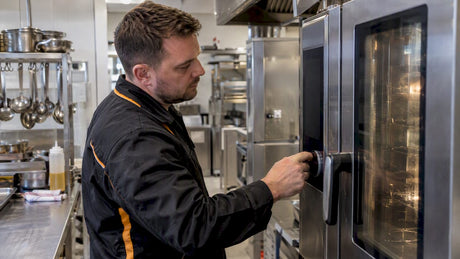 Technician diagnosing a Rational oven fault