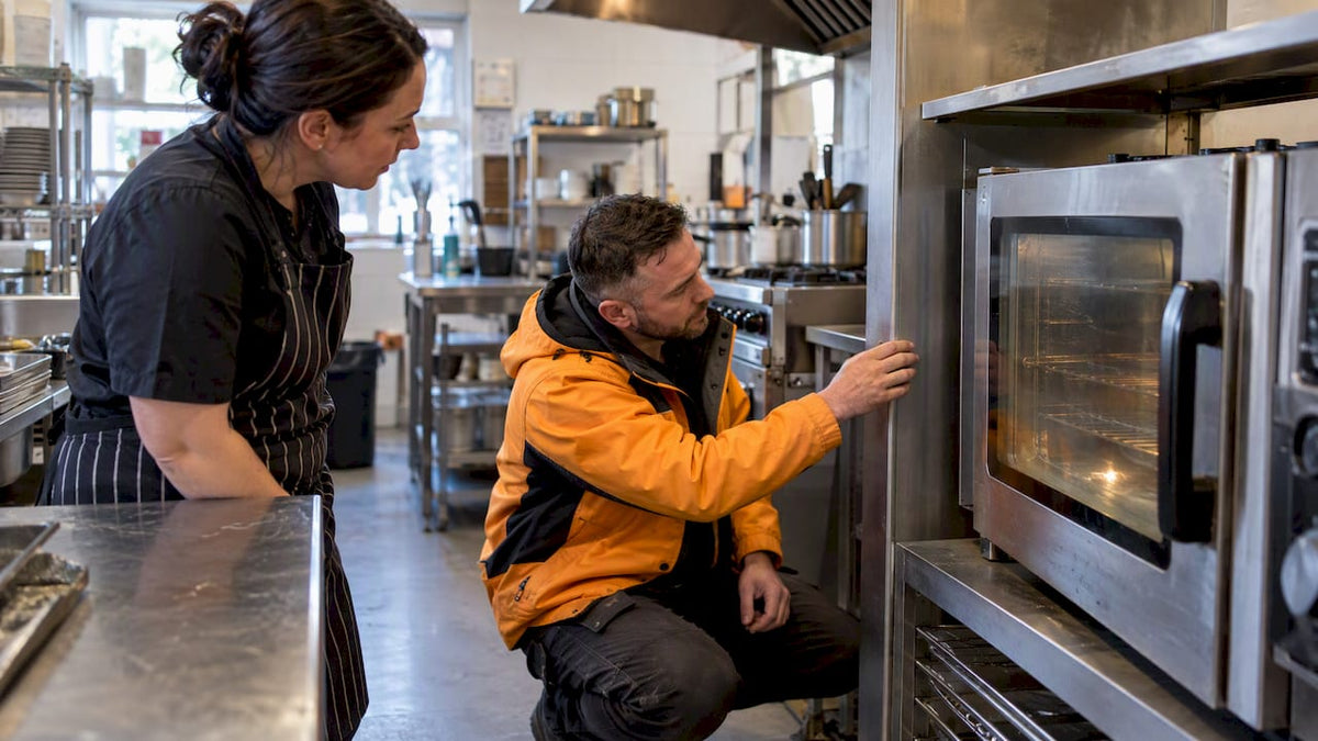 Engineer assessing a commercial oven replacement