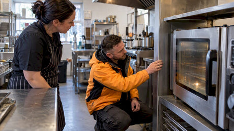 Engineer assessing a commercial oven replacement