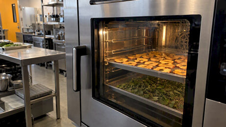 Apple rings and herbs drying in a combi oven